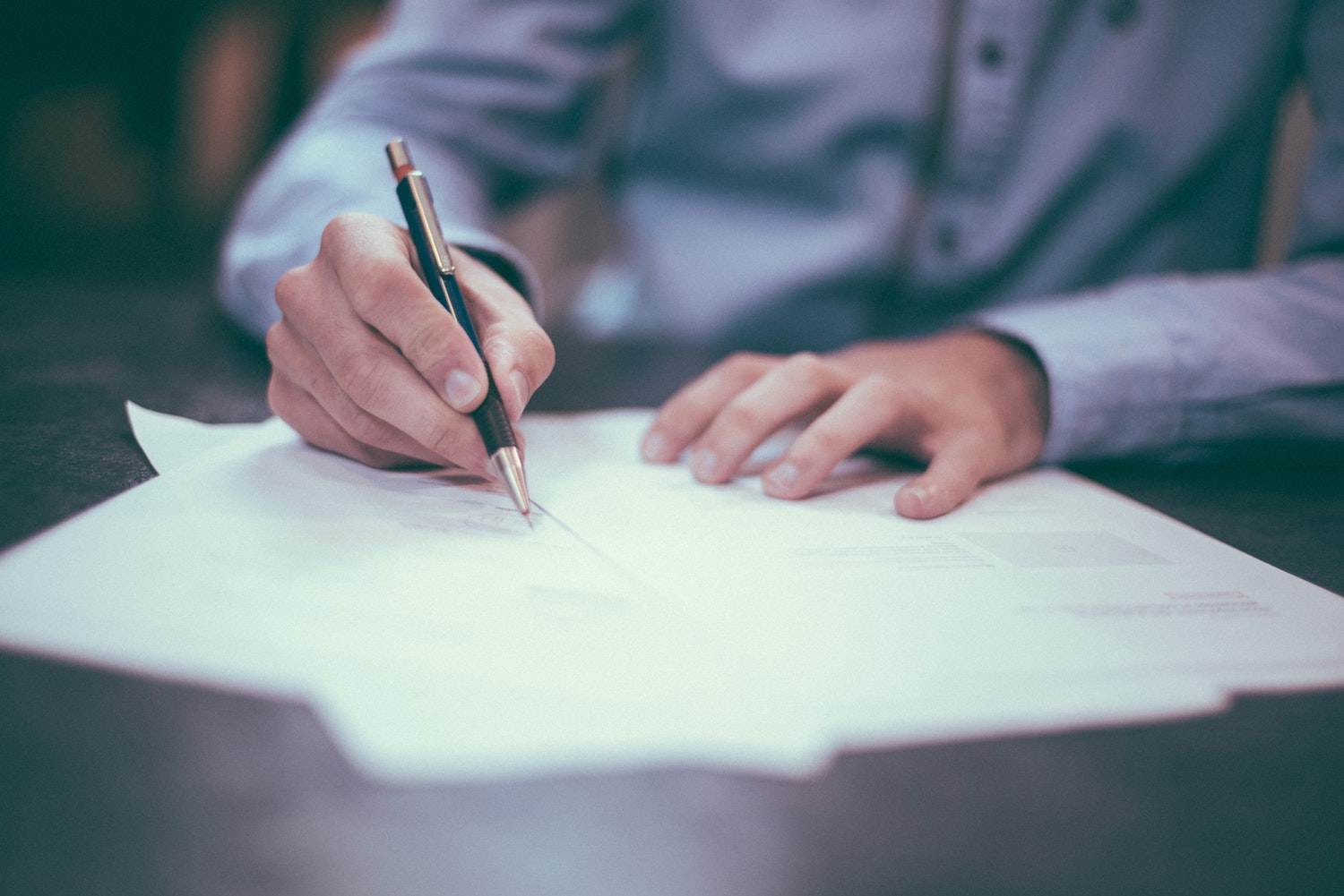 Man signing commercial lease